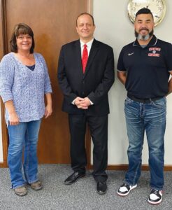 Westview School Corporation board member Carrie Schrock, left, stands with new Westview High School Principal Tim Wilson and board member Tim Helmuth. (Photo Contributed)