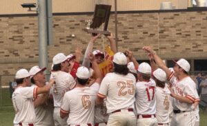 Warriors Baseball Team hoists up their trophy after defeating the Lakeland Lakers (Photo by Kahlina Siemers)